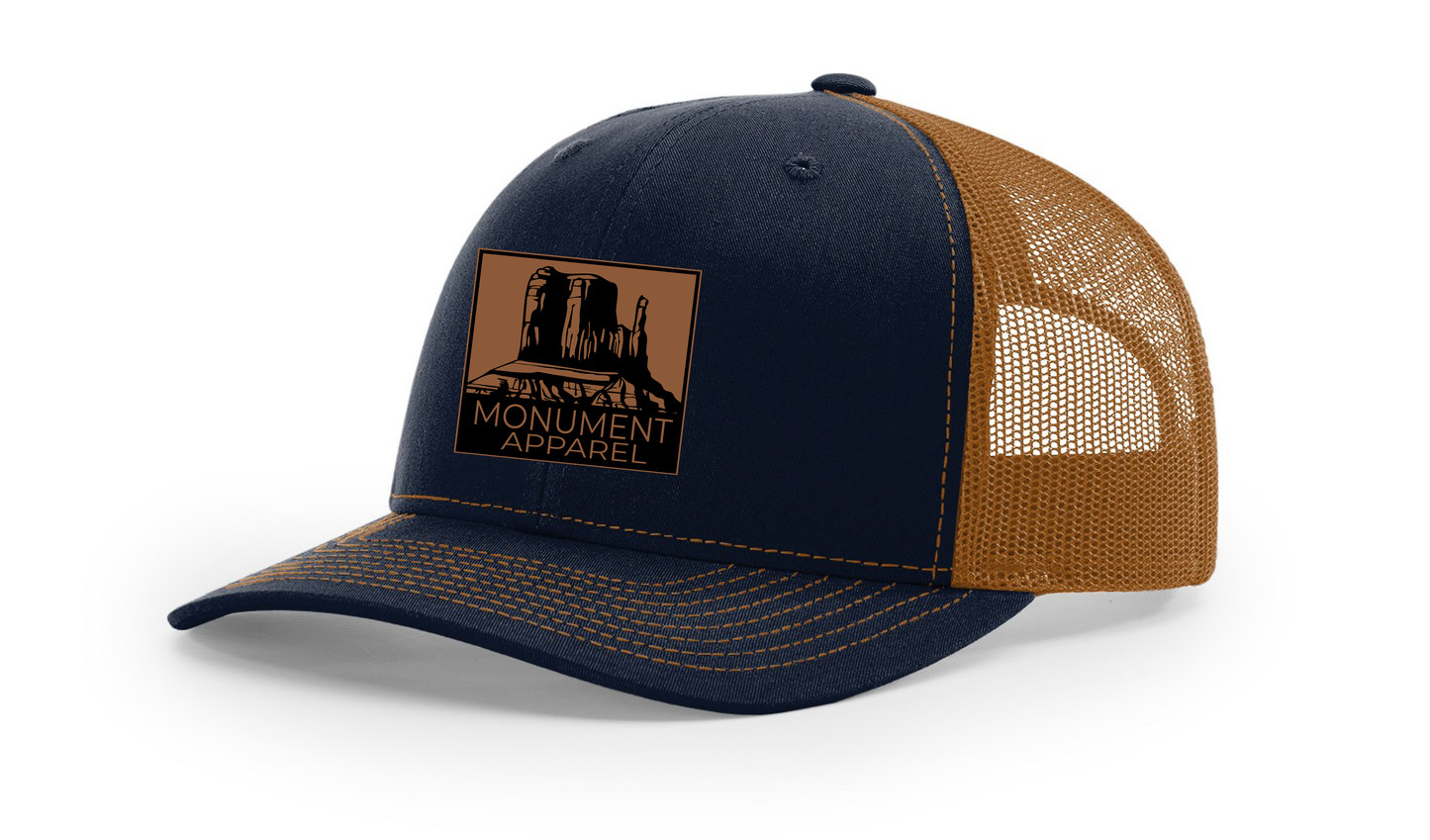 Monument Apparel Trucker Hat in Navy and Caramel