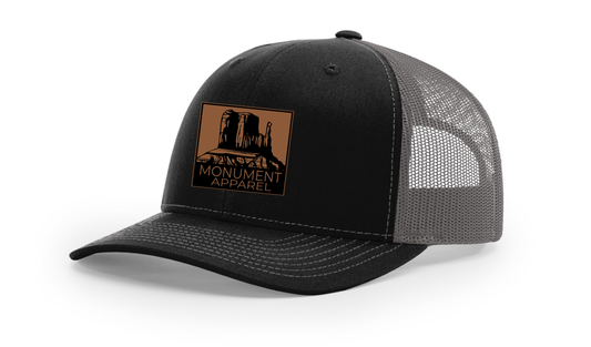 Monument Apparel Trucker Hat in Black and Charcoal
